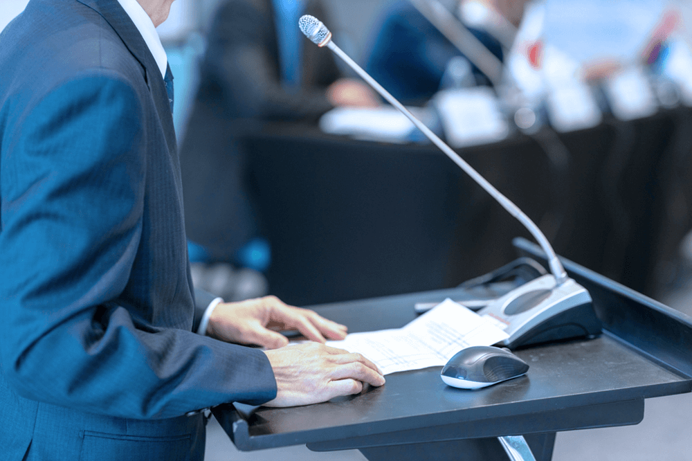 UAE ambassador speaking at podium during Political and Security Committee meeting in Brussels