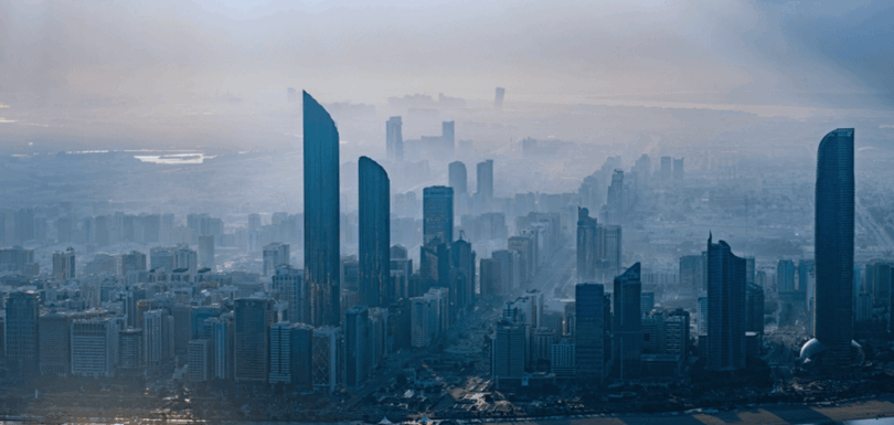Abu Dhabi city skyline showcasing modern urban development and sustainable green desert transformation initiatives