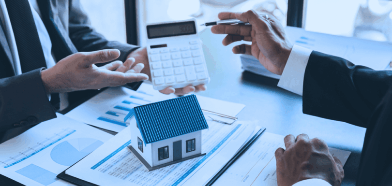 Business professionals analyzing loan documentation and financial reports related to personal guarantor obligations and restrictions