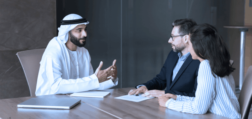 UAE legal professional consulting with clients about real estate register law and property legislation