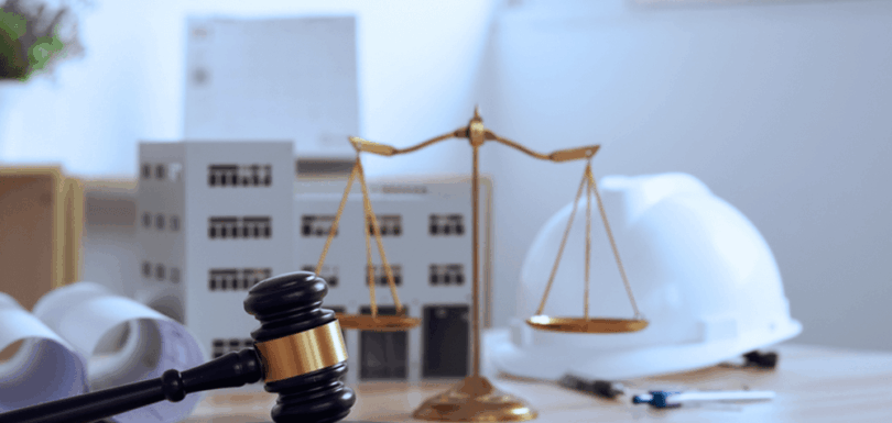 Legal gavel, scales of justice, and construction helmet representing UAE Ministerial Resolution on labour disputes