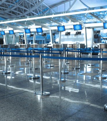 Empty airport check-in area in the UAE, symbolizing travel bans on personal guarantors