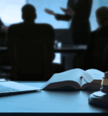 Law conference with gavel, book, and laptop representing UAE legal professionals shaping judicial principles