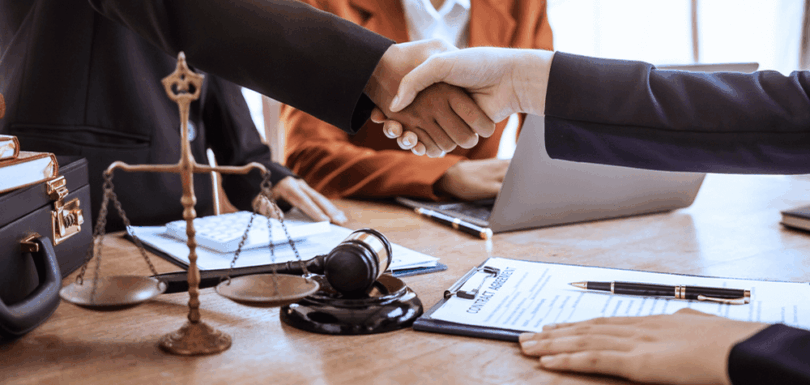 Handshake representing legal agreement - UAE Cabinet Resolution No. 122 of 2023 on Civil Personal Status