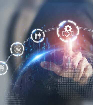 Businessman touching virtual icons representing business merger and acquisition process