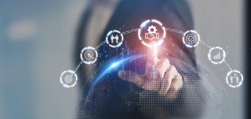 Businessman touching virtual icons representing business merger and acquisition process