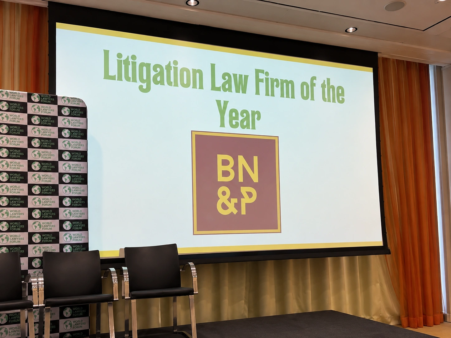 Screen announcing Bin Nakhira & Partners as Litigation Law Firm of the Year